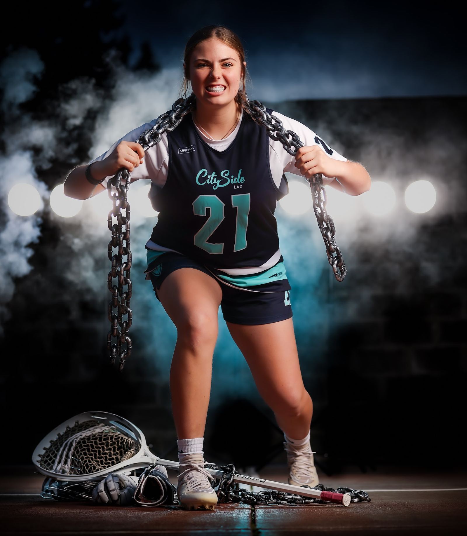 Lacrosse media day portrait with chains and smoke