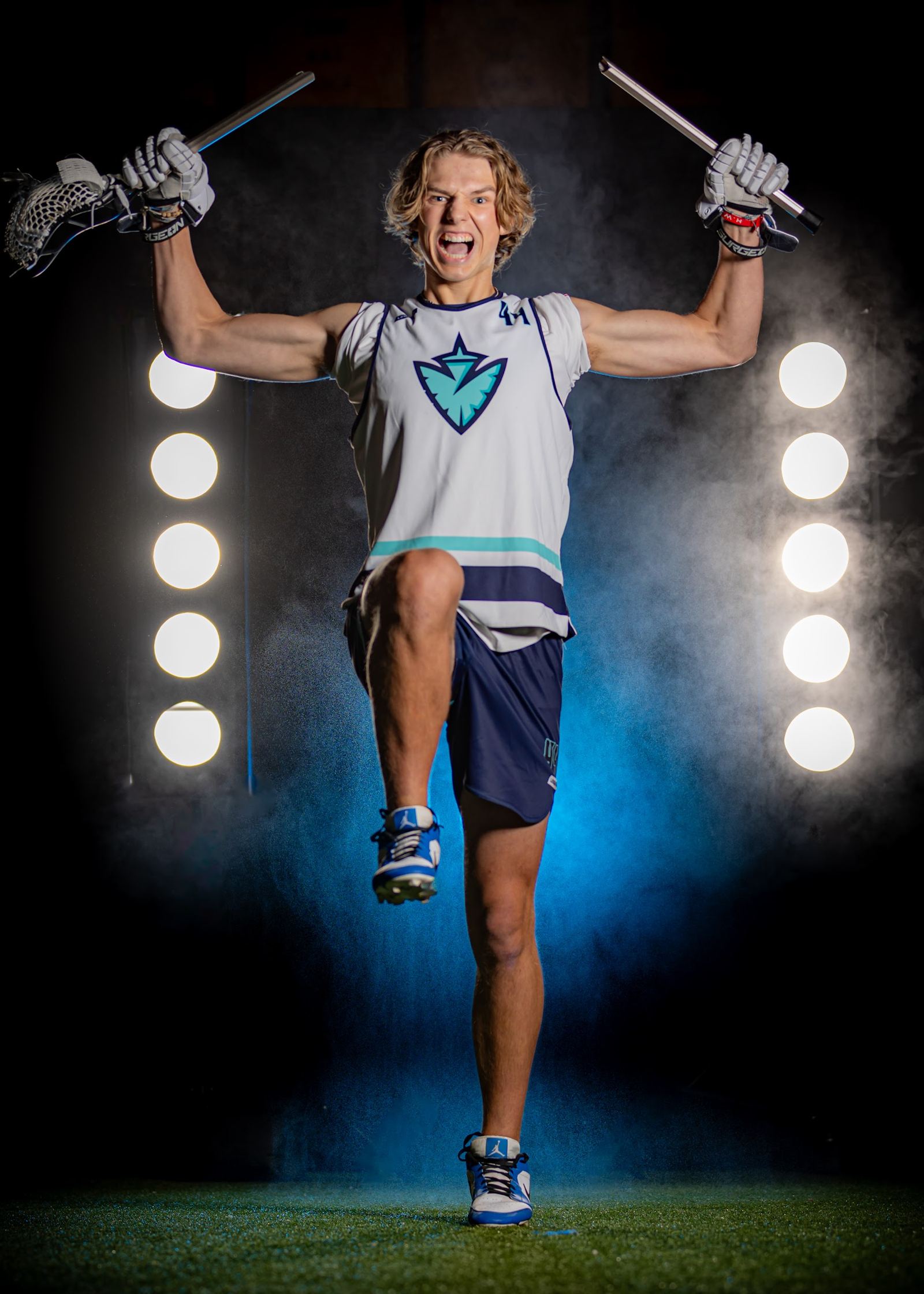 Lacrosse media day portrait with crossed sticks