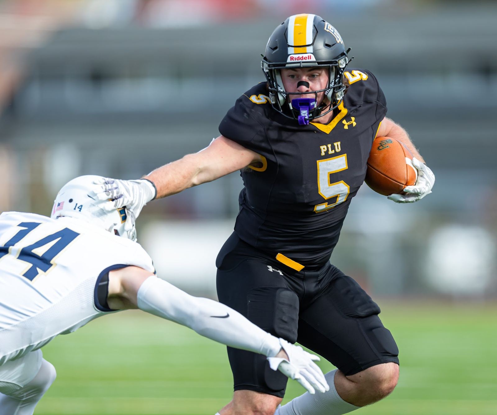PLU running back stiff-arm