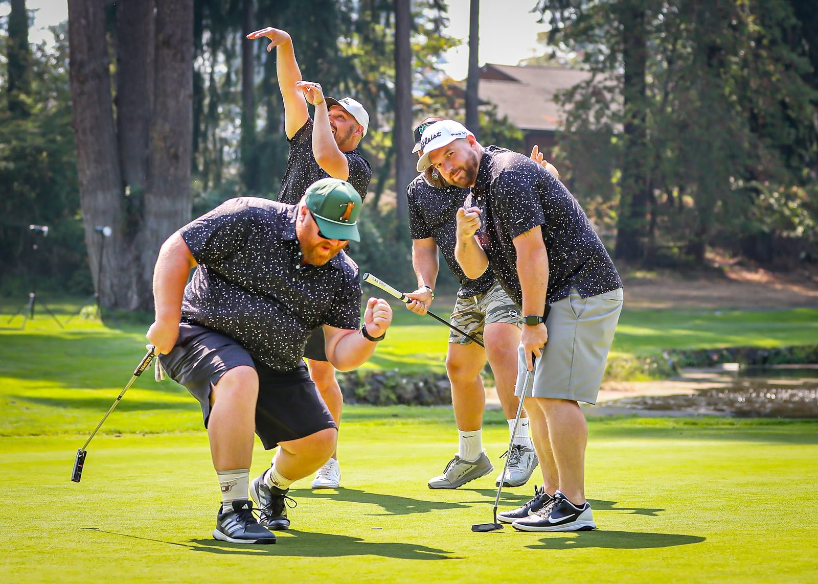 Golfers having fun mid-swing out on the course